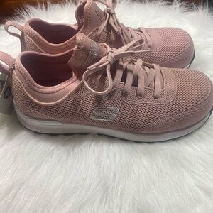 Skechers Industrial composite toe textile upper rubber sole.